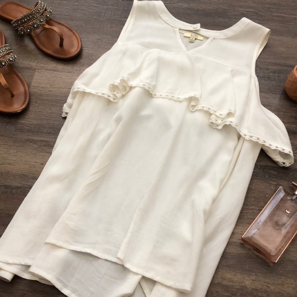 Off white blouse. Ruffle goes all around.